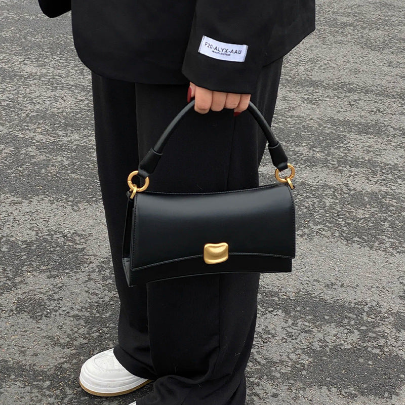 Black underarm baguette bag for women, 2026 new high-end texture niche handbag, popular crossbody bag this year